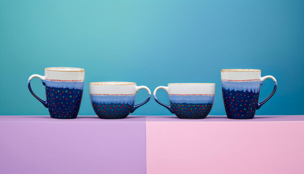 Hand painted ceramic Cappuccino mug. White, blue, red, orange, green.
