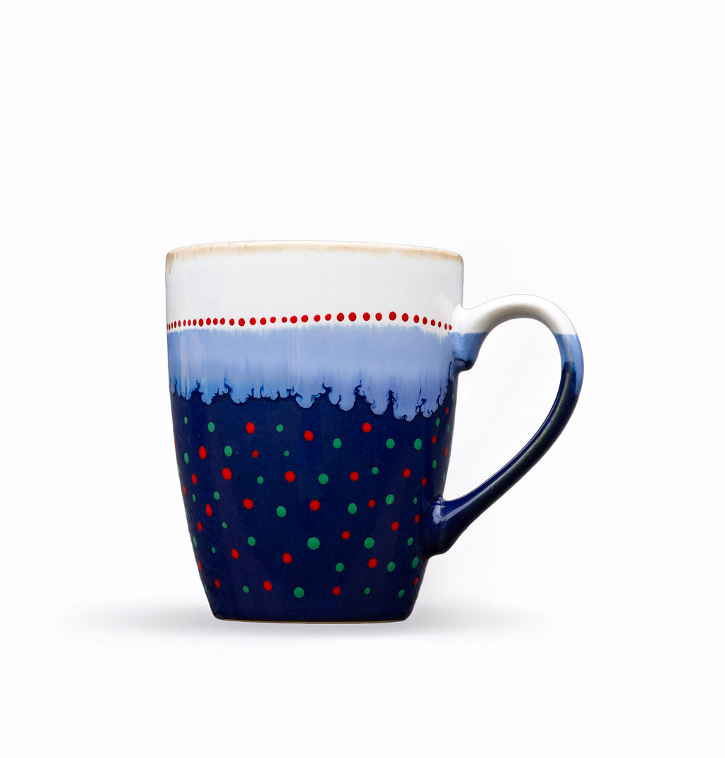 Hand painted ceramic tall coffee mug. White, blue, red, orange, green.
