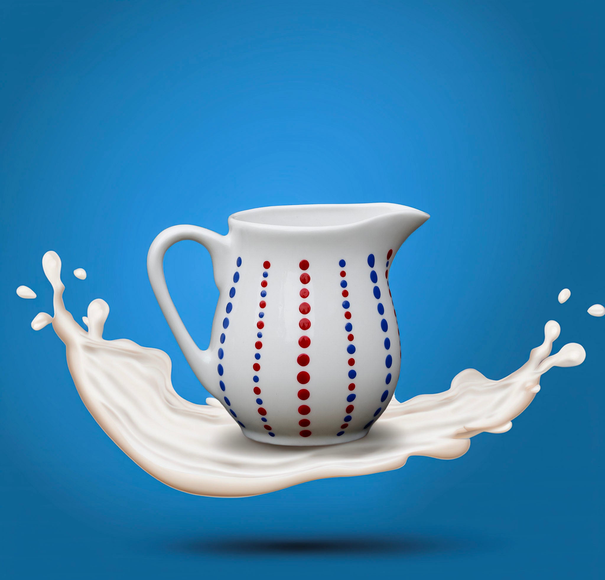 Hand painted ceramic milk jar. Blue and red. Polka Dots.