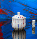 Hand painted ceramic sugar bowl. Blue and red. Polka Dots.
