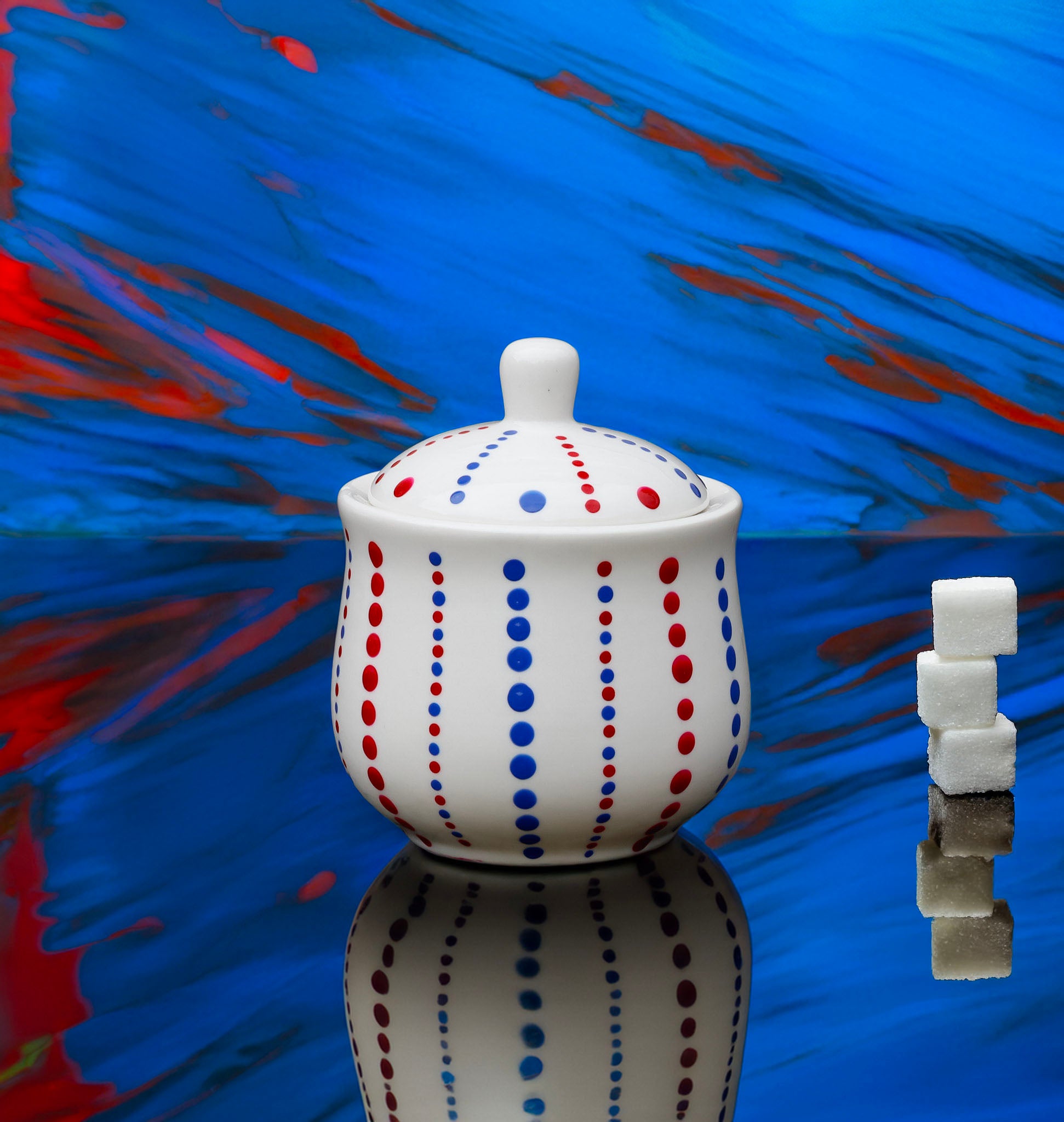 Hand painted ceramic sugar bowl. Blue and red. Polka Dots.
