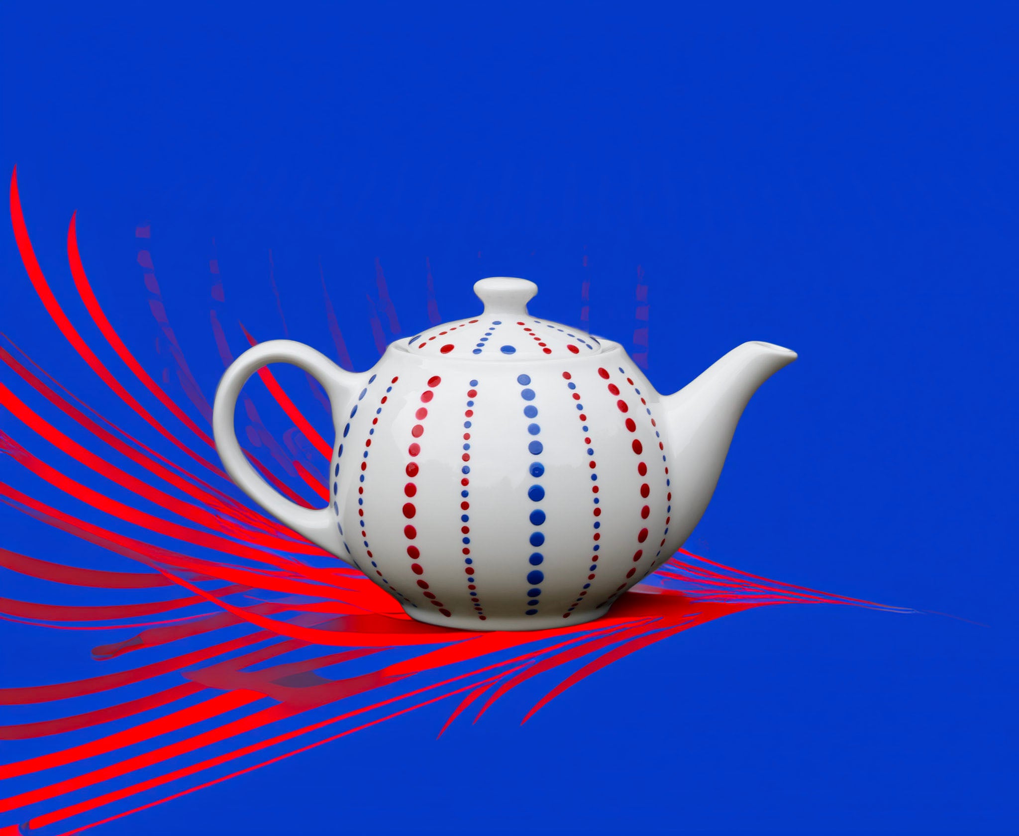 Hand painted ceramic tea pot. Blue and red. Polka dots.