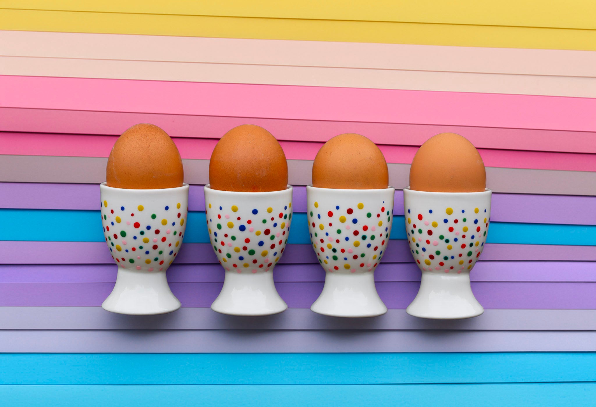 Hand painted ceramic egg holders. Colourful Polka Dots