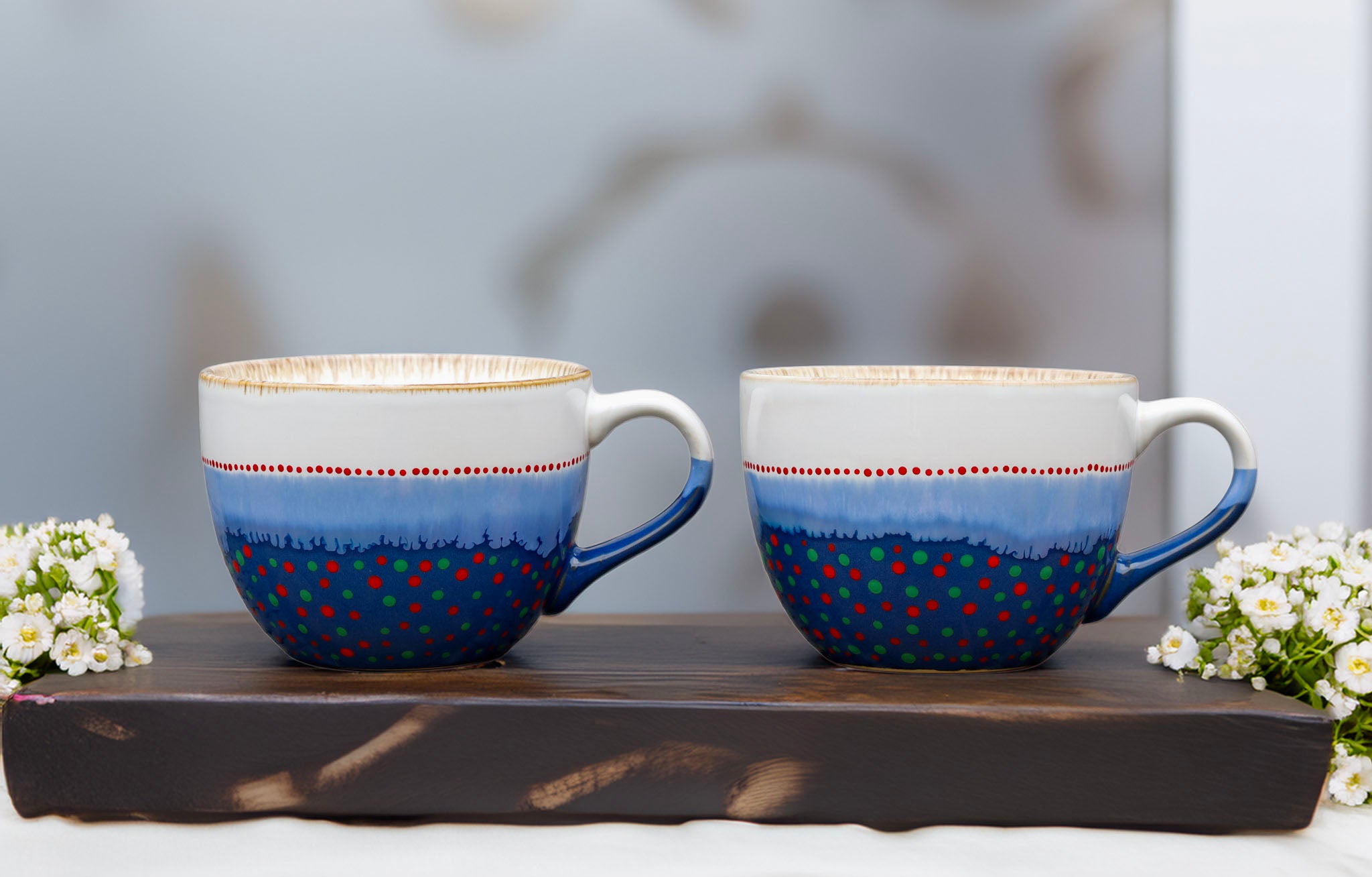 Hand painted ceramic Cappuccino mug. White, blue, red, orange, green.
