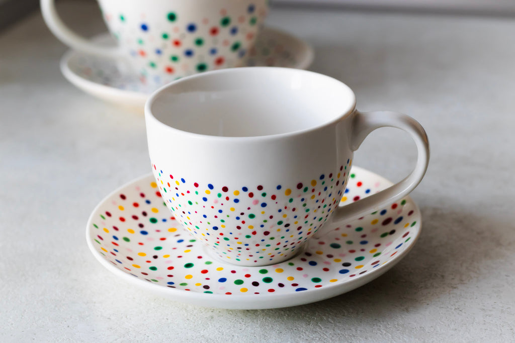 Hand painted ceramic cup with saucer. Colourful Polka Dots.