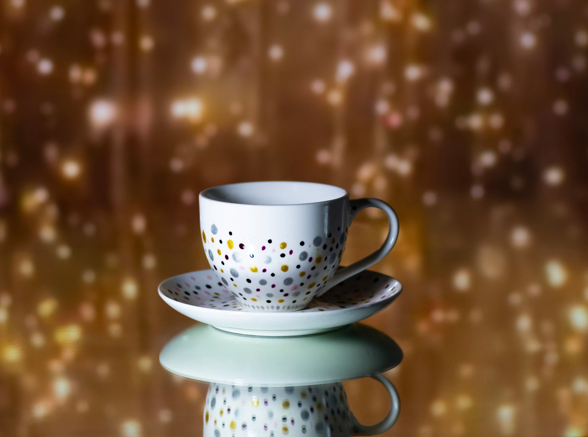 Hand painted ceramic cup with saucer. Pink, silver, golden. Polka Dots.