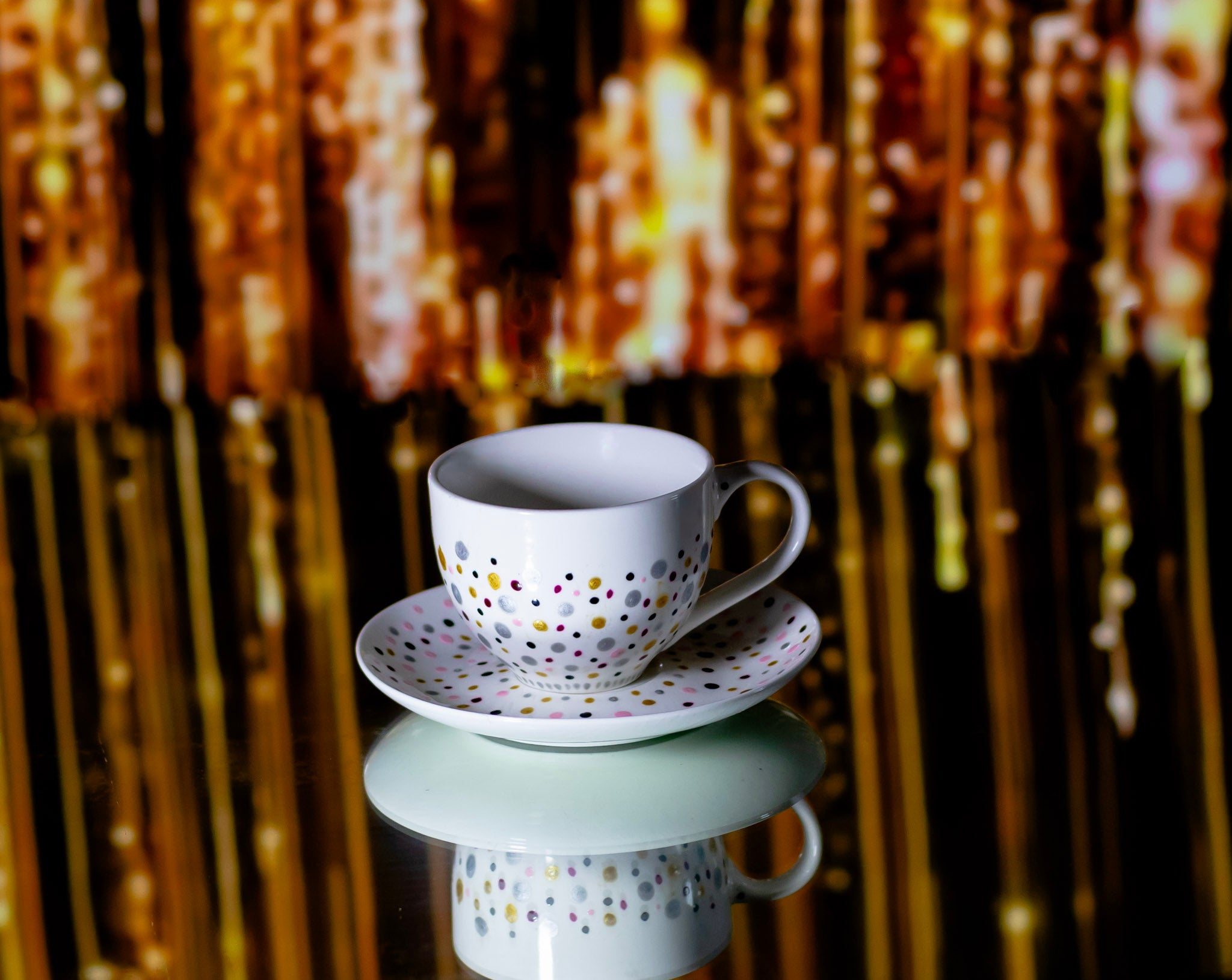 Hand painted ceramic cup with saucer. Pink, silver, golden. Polka Dots.
