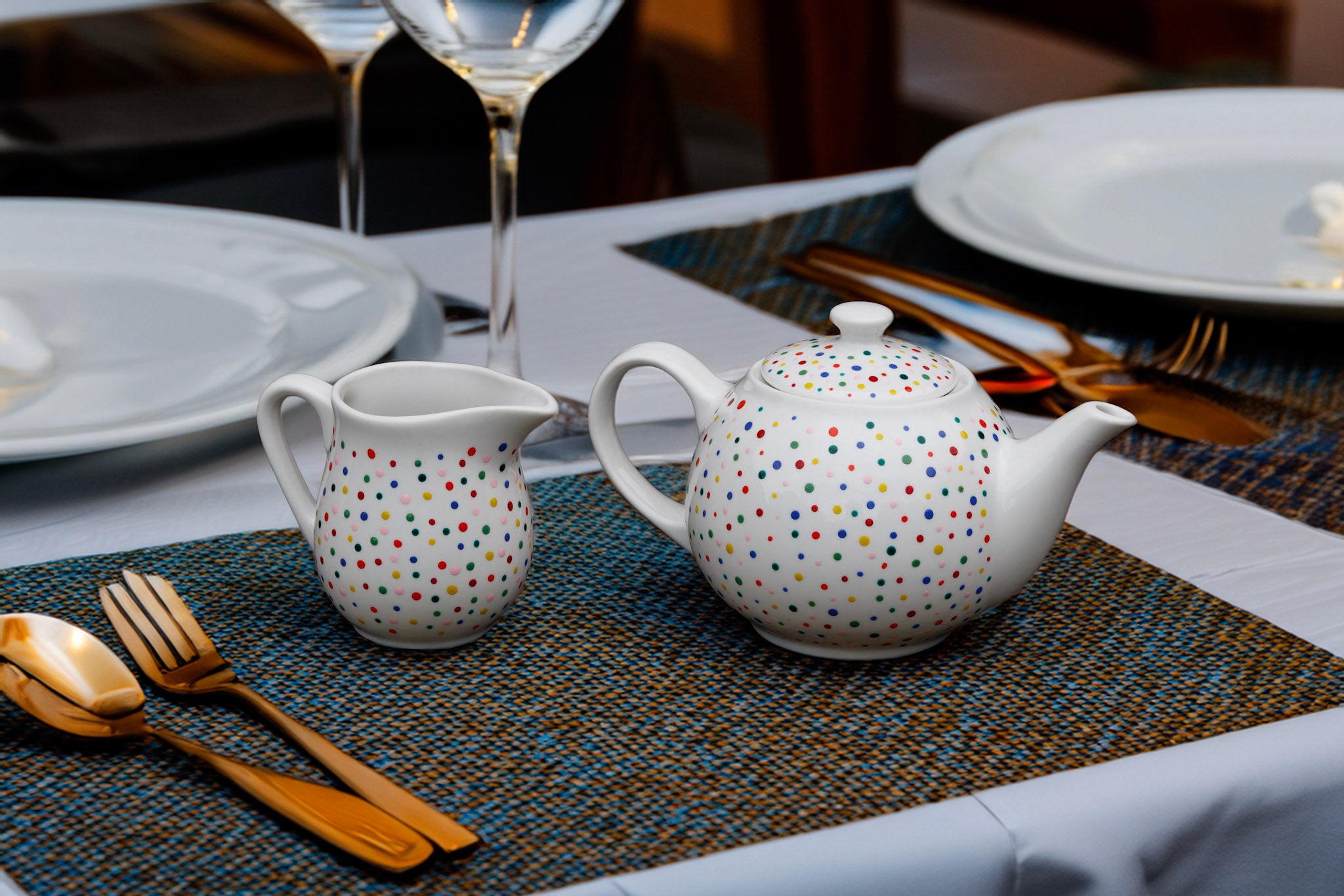 Hand painted ceramic milk jar. Colourful Polka Dots.