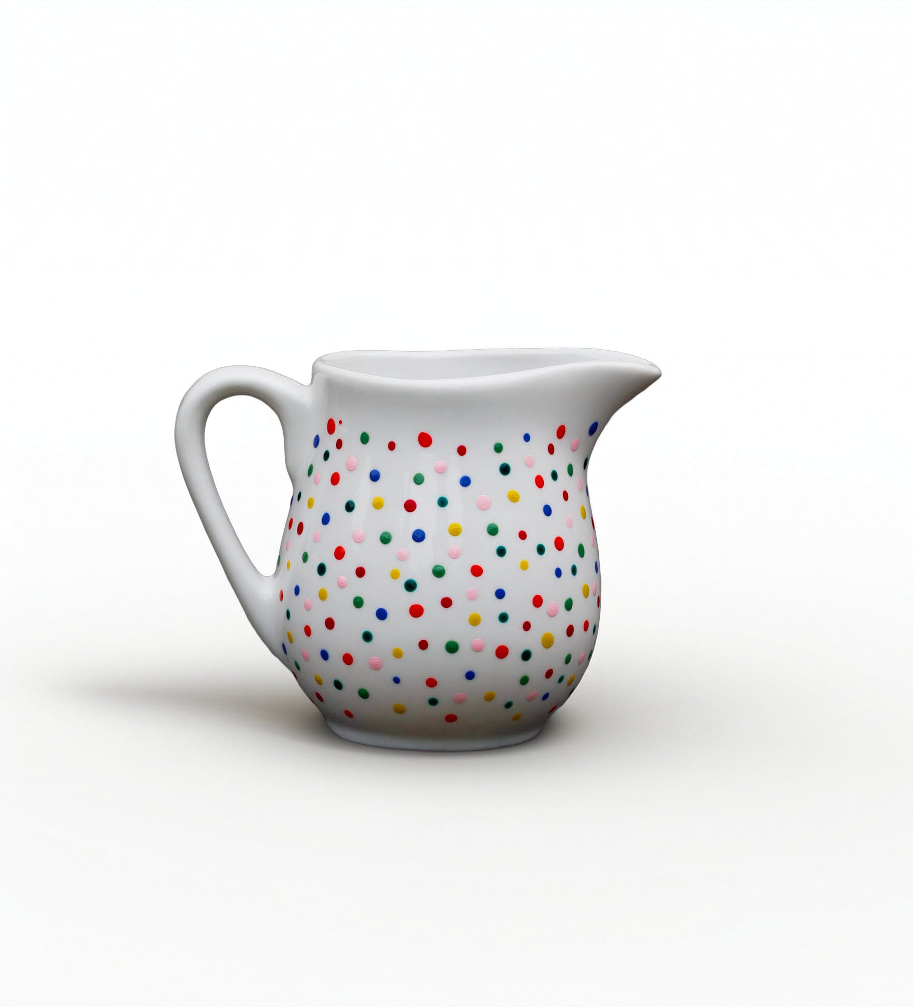 Hand painted ceramic milk jar. Colourful Polka Dots.