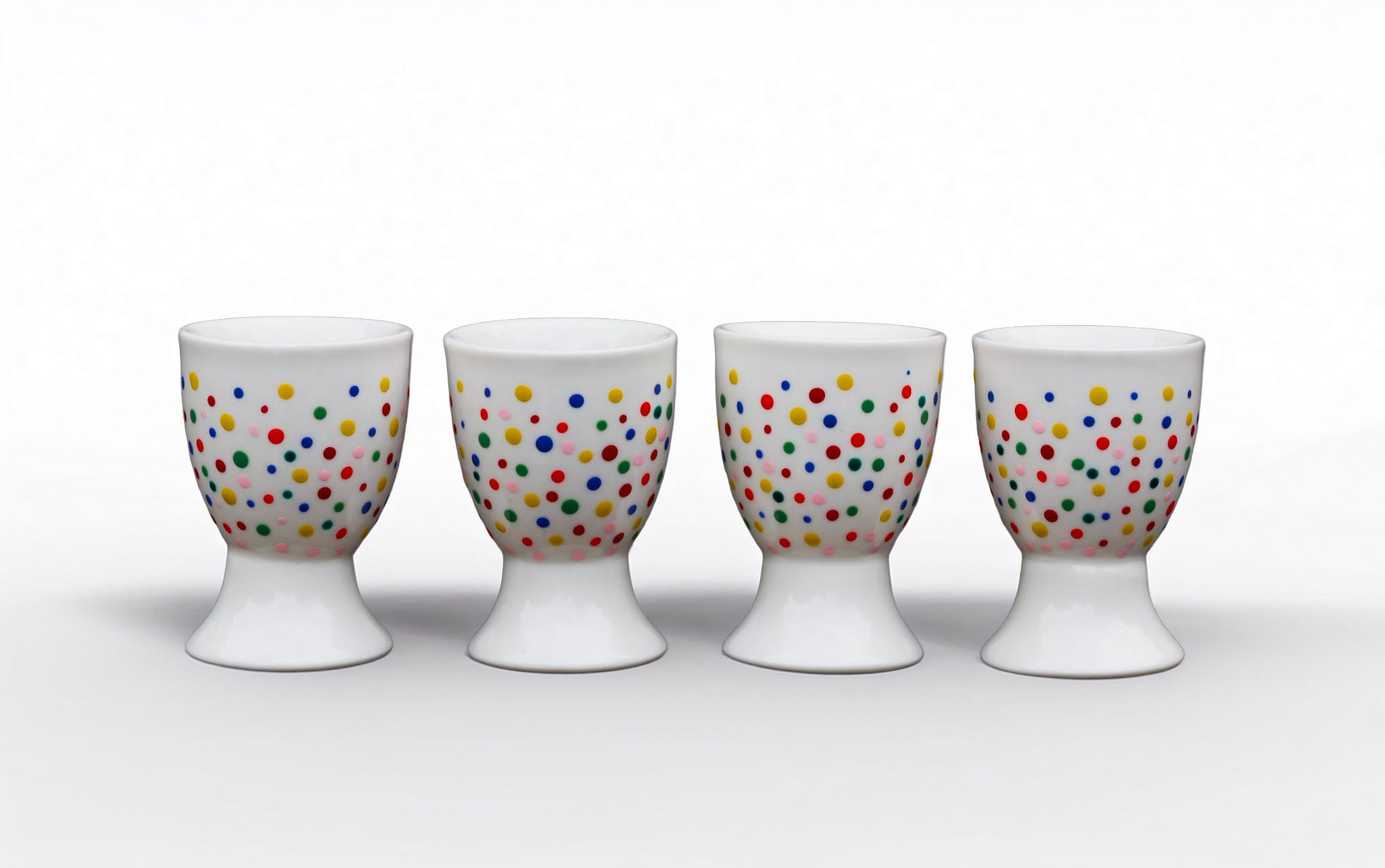 Hand painted ceramic egg holders. Colourful Polka Dots
