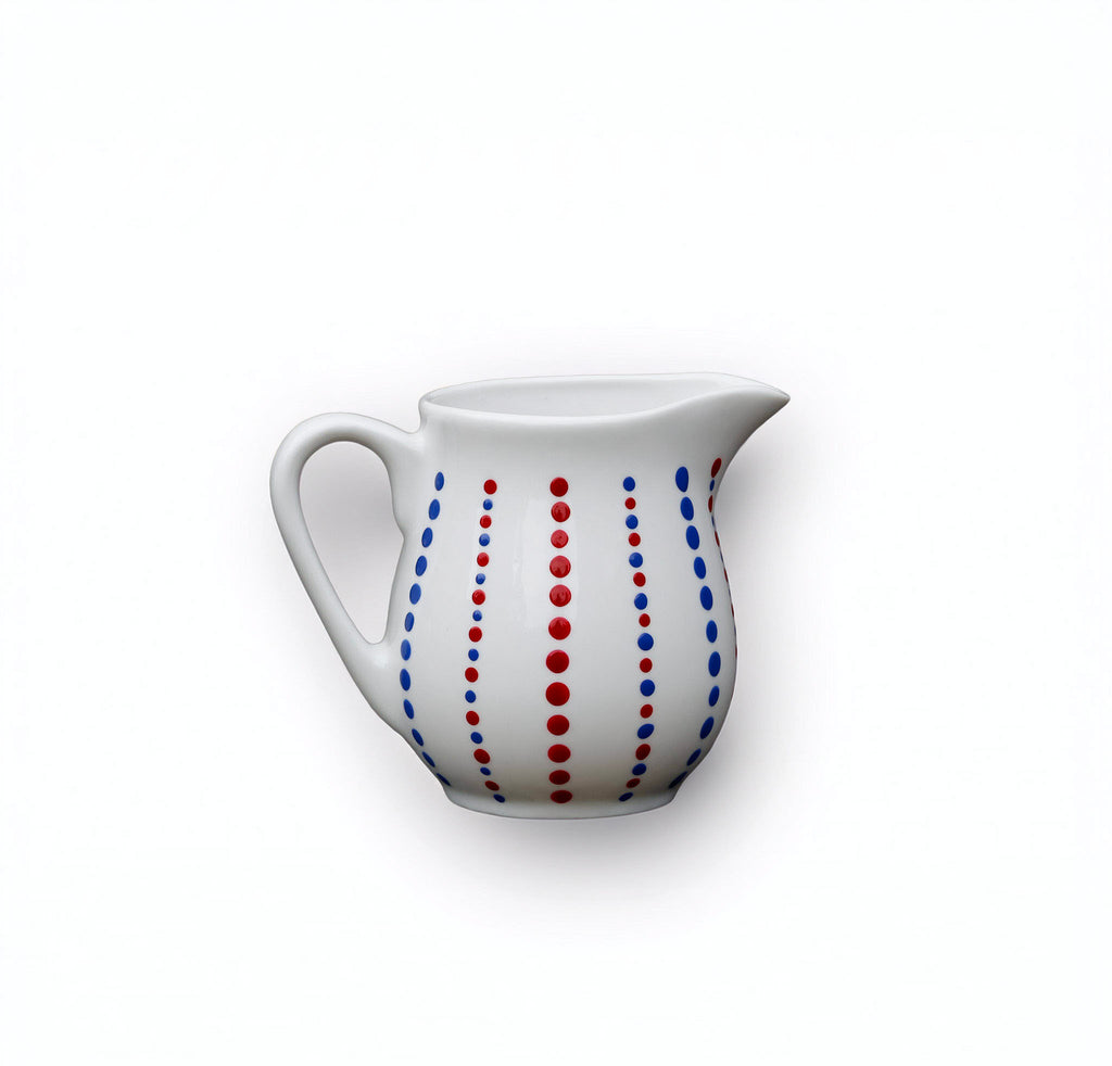 Hand painted ceramic milk jar. Blue and red. Polka Dots.